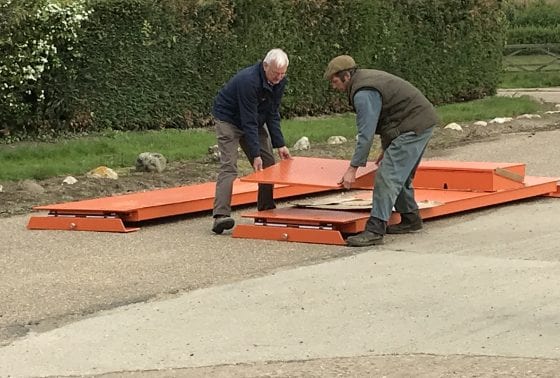 Placing the steel ramps down for the weigh beams