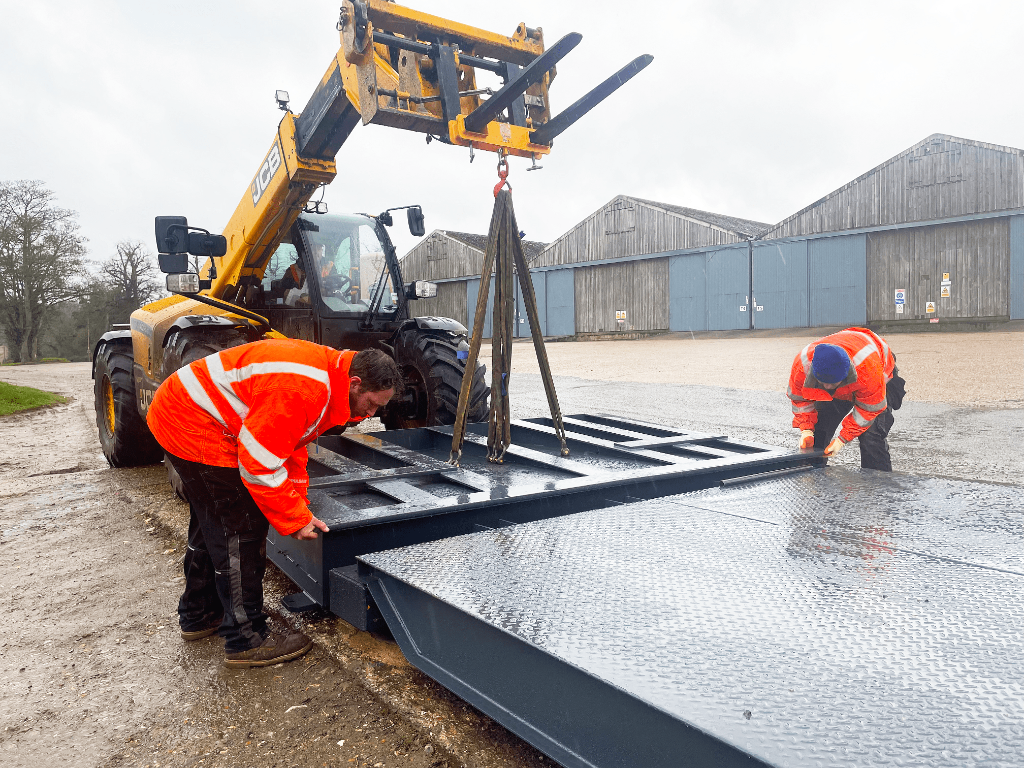 Weighbridge installation with folding ramps at Raynham Estate in progress.