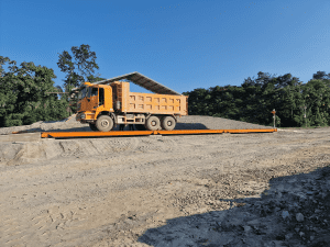 Pit-mounted weighbridge with driver terminal